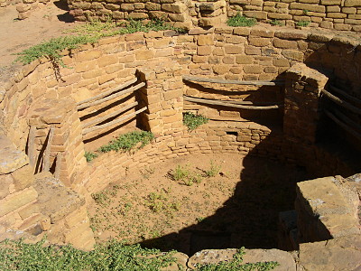 [Sub-surface parts of dwellings which are made of wood railings as wells as the adobe/stone bricks.]