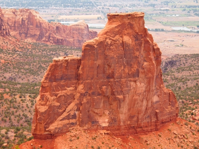 [The rock consumes most of the visible space in this photo. A canyon wall can be seen in the background.]