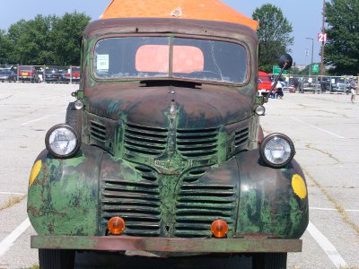 [Rusty green pickup truck.]