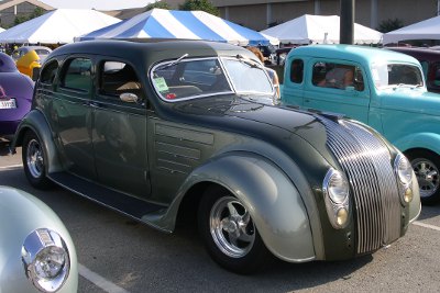 [Grey behemouth of a car.]