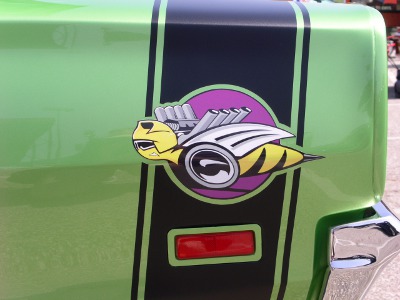 [Souped up bee painted on side of a Superbee car.]