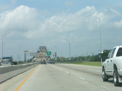 [Highway bridge seeming to go right up into the sky.]