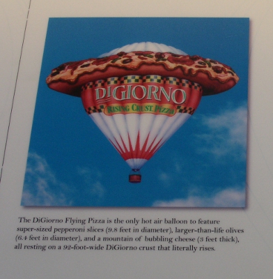 [White balloon with pizza ringing around it near the top of the balloon. Name DiGiorno and words Rising Crust Pizza are on the balloon below the simulated pizza.]