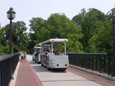 [Back end of a 3 car tram full of people as it passed me on the bridge.]