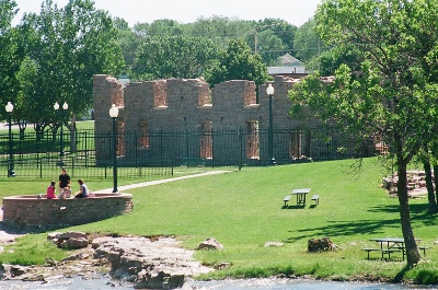 [One and a half stories of the exterior wall of the mill built of huge stone blocks.]