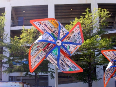 [Pinwheel created from license plates attached to form panels then folded to create the pinwheel.]