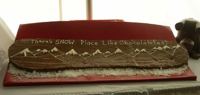 [Chocolate shaped like a snowboard with a mountain scene and the words, 